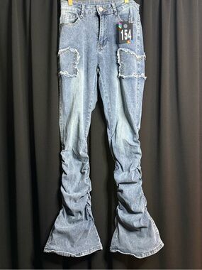 Light Blue Ruched Flare Jeans with Distressed Knee Patches